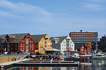 Scenic view of the harbour in Tromsoya island with buildings and boats in Norway