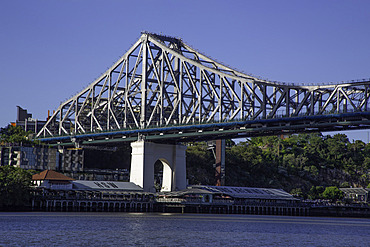 Spotlights on Story Bridge and Howard Smith Wharves along the Brisbane River in Queensland, Australia
