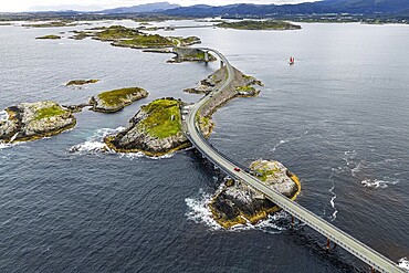 Aerial view of the Atlantic Ocean Road (Atlanterhavsveien), red sailing boat, Norway