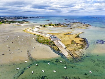 Aerial view of the peninsula, &Icirc;lot Sainte-Anne and the surrounding Wadden Sea landscape on the Breton coast with shallow sandbanks in turquoise seawater, Saint-Pol-de-L&eacute;on, Finist&egrave;re, Brittany, France