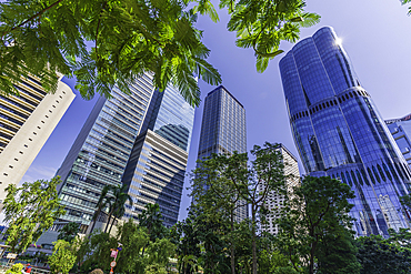 View of modern buildings and green space in urban setting on Hong Kong Island in Asia