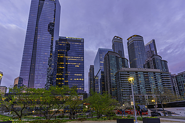 Downtown Toronto features modern buildings under dusk sky in Ontario, Canada