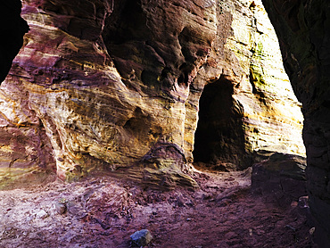 Exploring the unique rock formations and cave entrances at Caiplie Caves located near Crail in Fife, United Kingdom<br />845-1660 Exploring the unique rock formations and cave entrances at Caiplie Caves located near Crail in Fife, United Kingdom