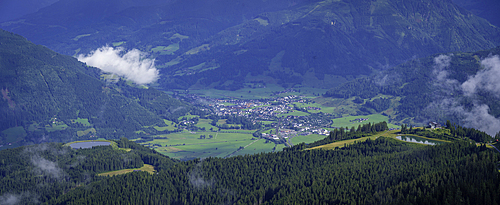Stunning view from Schmittenhohebahn top station overlooking Kaprun and surrounding landscape on a sunny day in Austria