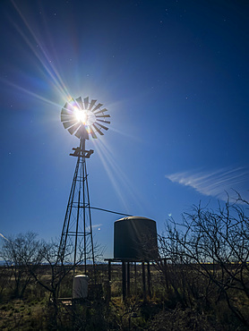 The full moon rising in the east near Whitewater Draw State Wildlife Area near McNeal in southeast Arizona, USA.