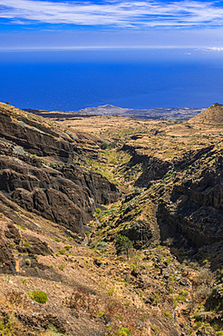 View of volcanic landscape and coast on Fogo Island in Cabo Verde, showcasing geological features and blue ocean expanses
