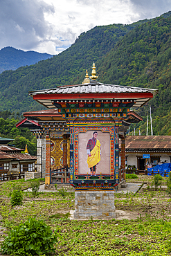 Traditional stupas stand prominently amidst greenery in Trashiyangtse, showcasing Bhutanese architecture in Eastern Bhutan