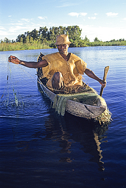 Fisherman with pirogue on Pangalanes Canal, Southeast of Madagascar, Indian Ocean, Southeast Africa