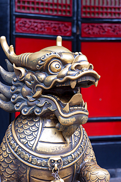 Lion statue stands at the entrance of Wenshu Monastery in Chengdu, Sichuan, China, showcasing traditional design elements and cultural heritage<br />800-4691 Lion statue stands at the entrance of Wenshu Monastery in Chengdu, Sichuan, China, showcasing traditional design elements and cultural heritage