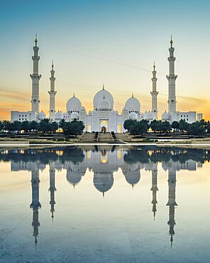 Sheikh Zayed Mosque in Abu Dhabi, UAE, at dusk with reflection in the water