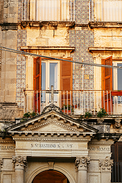 Windows and architectural details on a historic building in Ortygia Island in the evening light<br />848-4264 Windows and architectural details on a historic building in Ortygia Island in the evening light