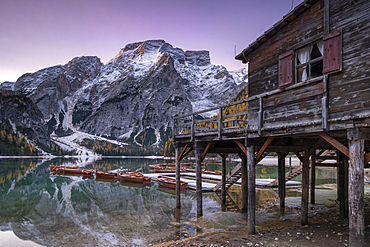 The Stilted Boathouse at Lago di Braies backed by Croda del Becco Mountain, Fanes-Senes-Braies Nature Park, Val Pusteria, South Tyrol, The Dolomites, Italy