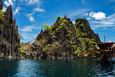 Exploring the rock formations and clear waters of a lake in Coron, a popular spot in the Philippines
