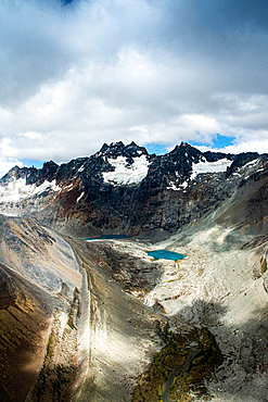 View of Andes mountains in Argentina with glacial lakes and storm clouds forming