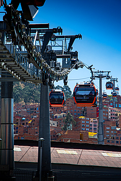 Sky tram system connects neighborhoods above city buildings in La Paz with views of urban landscape in Bolivia